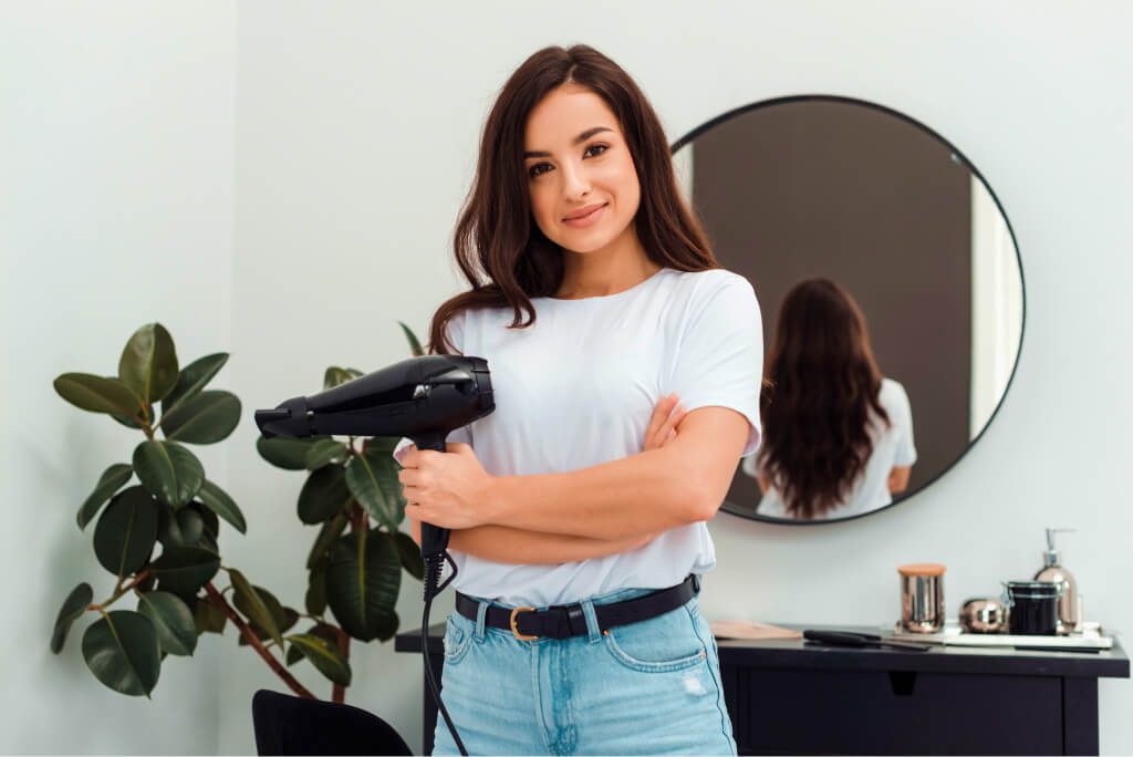 a professional hairdresser stands in a beauty salo utc