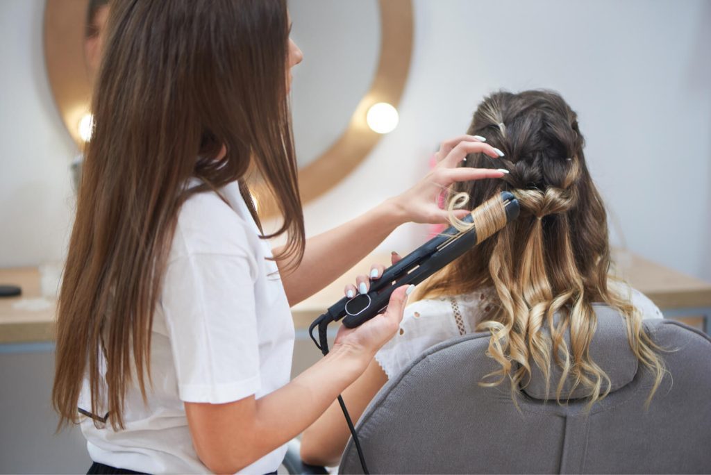 process of making trendy hairstyle in beauty salon utc